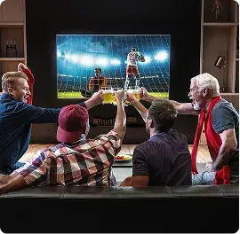 Friends watching United Kingdom IPTV football on a big screen